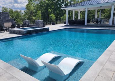 hollis new hampshire pool in backyard with pergola and spa