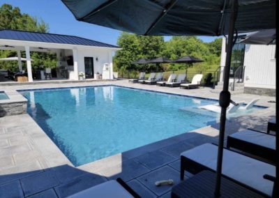 hollis new hampshire pool in backyard with umbrella