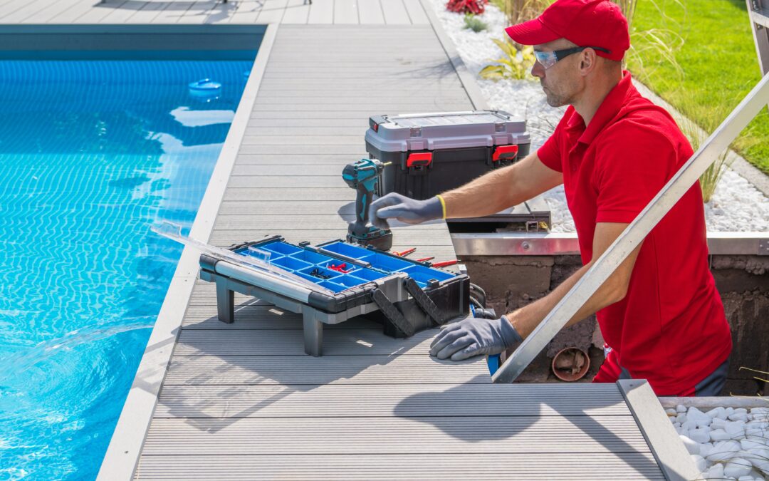 A man in a red uniform and gloves performing a pool maintenance